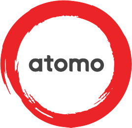Red painted circle with the word 'atomo' in the centre in dark grey