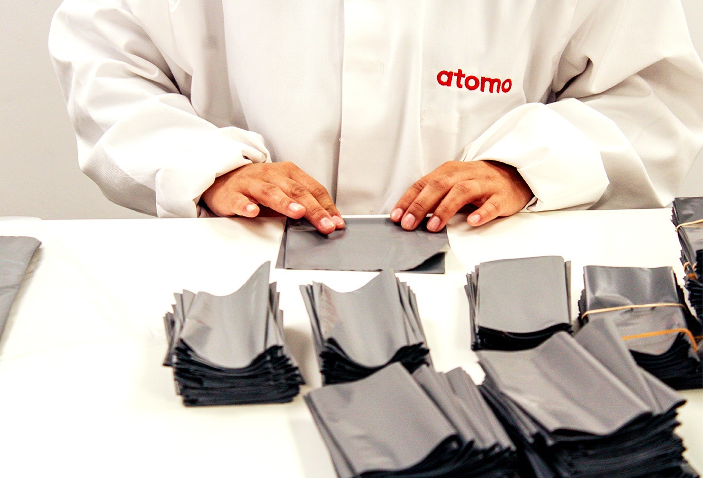 Lateral Flow Manufacturing person in lab coat assembling product